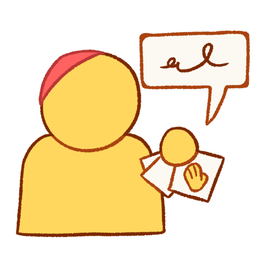 a bust of an emoji yellow person wearing a pink kippah and holding communication cards, which show a hand on them. there is a speech bubble containing a scribble coming from the cards.